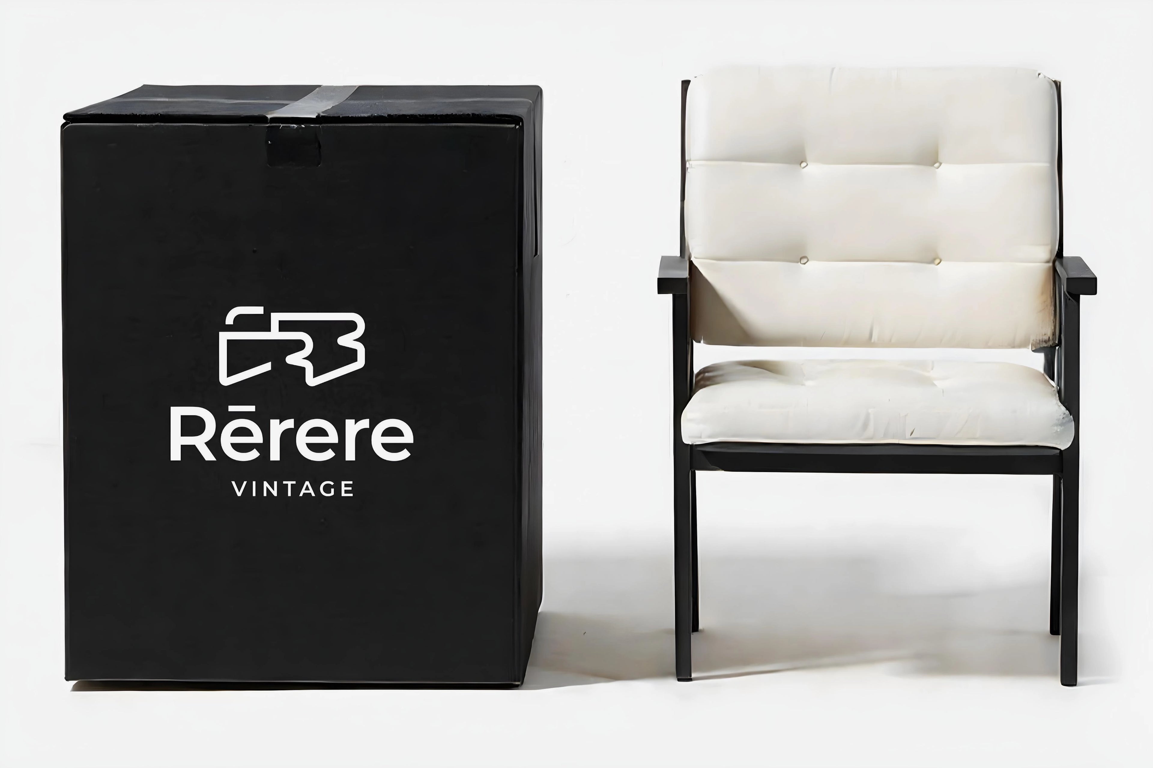 Black box with 'Rérère Vintage' logo next to a white chair on a white background